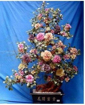 85S: LG. JADE BONSAI FLOWERS TREE: 201-88 THIS BEAUTIFUL JADE FLOWER TREE IS MADE OF REAL JADE IN CHINA. ALL FLOWERS AND LEAVES ARE MADE OF GENUINE JADE. ITS LEAVES AND BASE WERE MADE OF TAIWAN JADE. IT TOOK THE SCULPTORS AT LEAST 3 TO