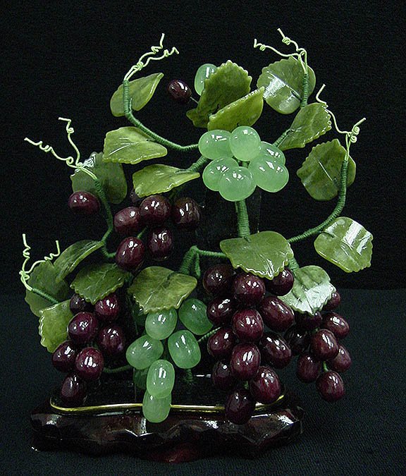 MIXED JADE GRAPES VINE SIZE: HEIGHT: 9.5", WIDTH: : SKU: C THIS BEAUTIFUL WORK IS MADE OF 100% NATURAL LAVENDER JADE, TAIWAN JADE. ABSOLUTELY NOT PAINTED AND DYED. BUNCHES OF GRAPES, MADE OF LAVENDER AND SOUTHERN JADE, ARE HANGING ON THE TREE LEAVES AR