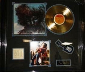 Autographed Jimi Hendrix Gold Record Collage: Autographed Jimi Hendrix Gold Record Collage. Autograph is lazer matted. Gold record is licensed and gold plated. Small guitar is not operable. All hand assembled and licensed. Beautifully framed and 