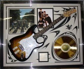 Autographed Beatles Collage Guitar: Autographed Beatles Collage Guitar, autograph is lazer matted, beautifully framed and comes with COA, record is licensed and gold plated