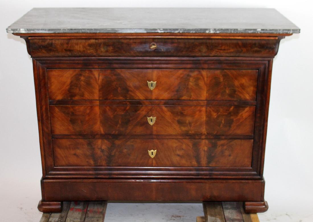 Louis Philippe commode with marble top: French Louis Philippe commode in flame mahogany with marble top. 19th century. 36 3/4"h x 49 1/2"w x 21 1/4"d