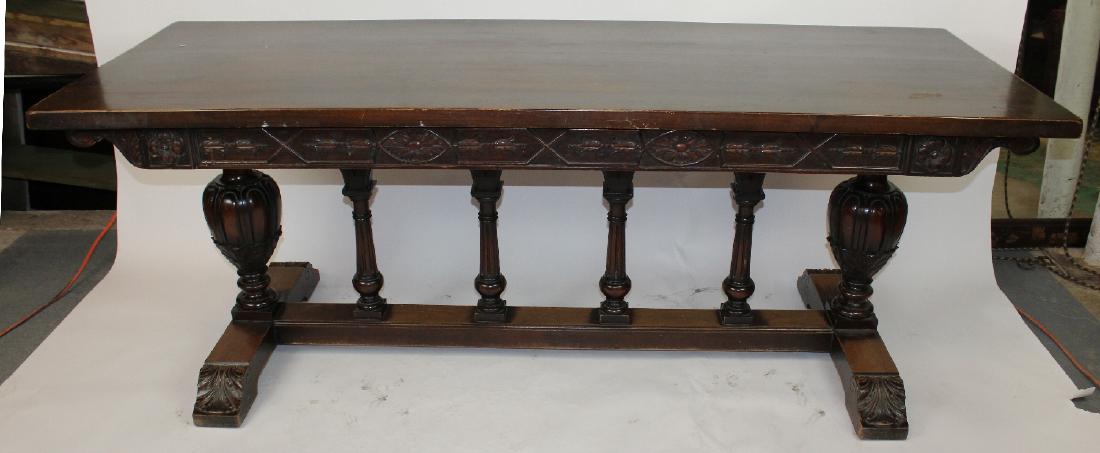 English Jacobean style dining table: English Jacobean style dining table in oak with carved base. 20 th century. 30 3/4"h x 82"w x 31"d