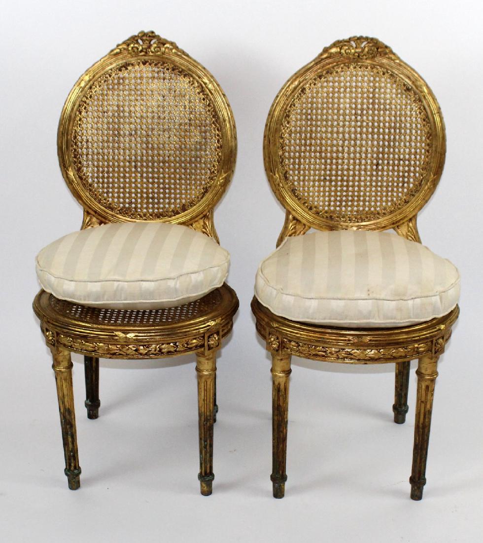 Pair of Louis XVI style gilt side chairs (1 of 4)