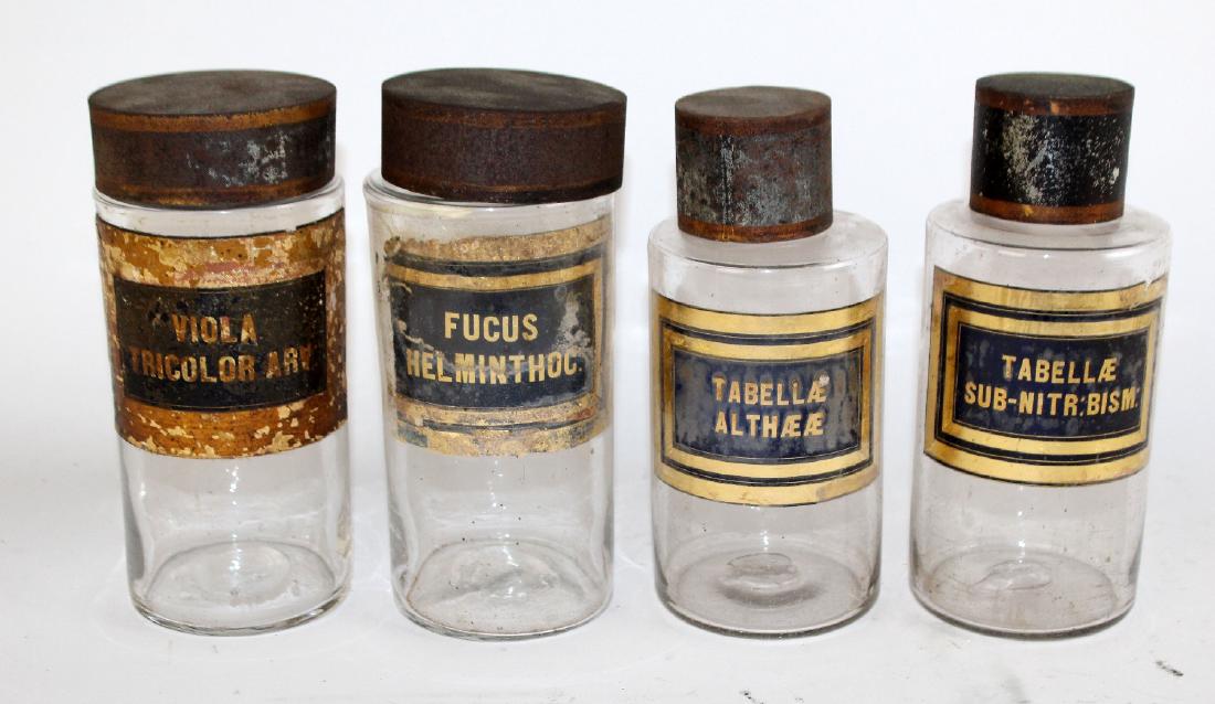 Lot of 4 clear glass apothecary bottles (1 of 4)