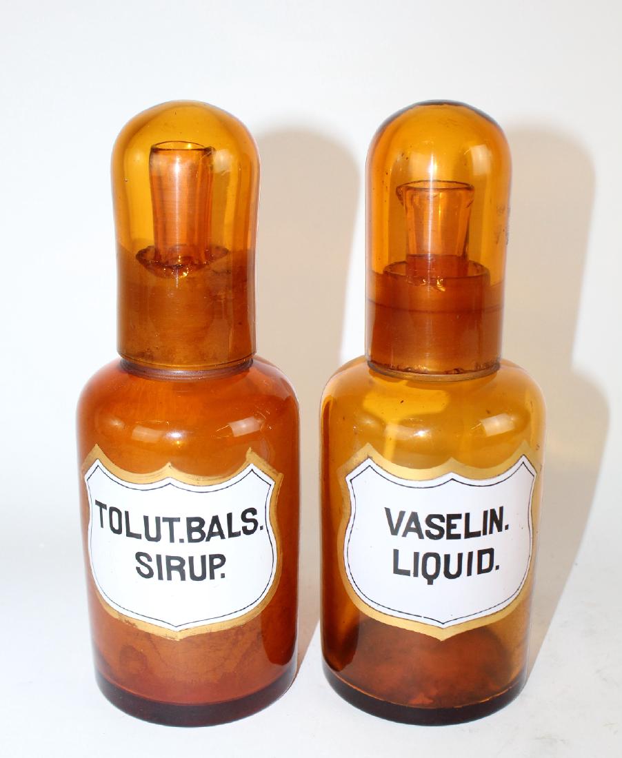 Lot of 2 amber glass apothecary bottles. (1 of 5)