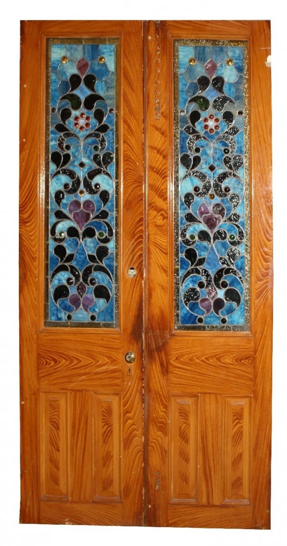 Pair American stained, leaded and jeweled glass doors: Pair of American stained and leaded glass entry doors. Late 19th/early 20th century. 48"w x 90 1/4"h