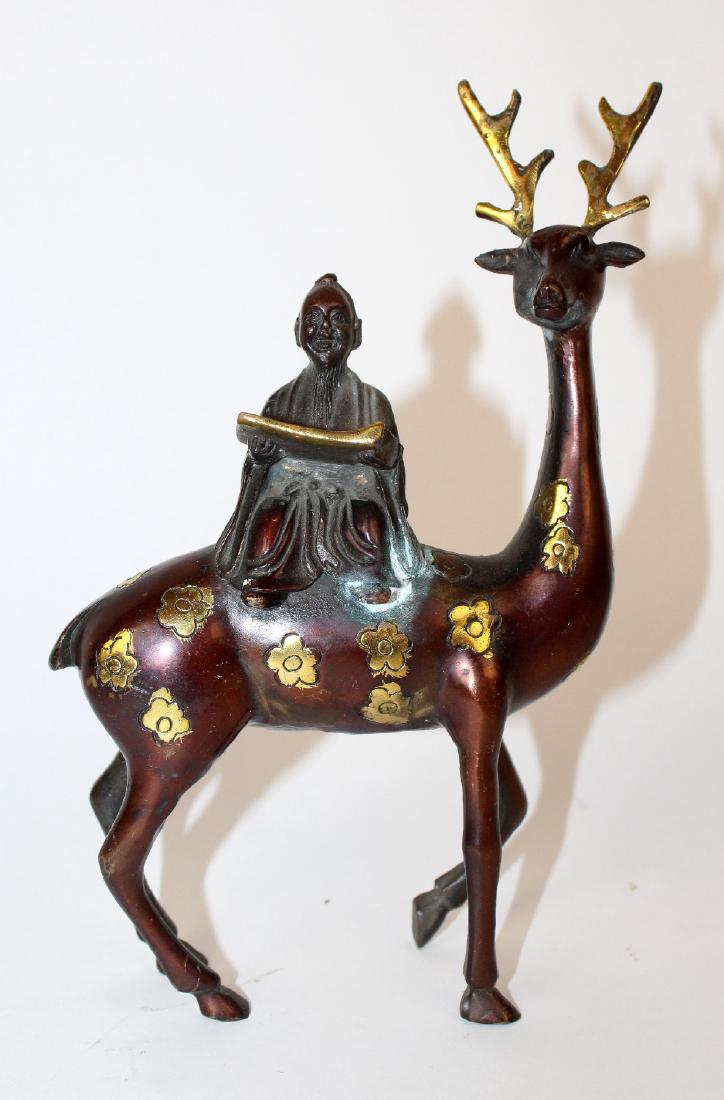 Polychrome bronze figurine on man on deer (1 of 4)