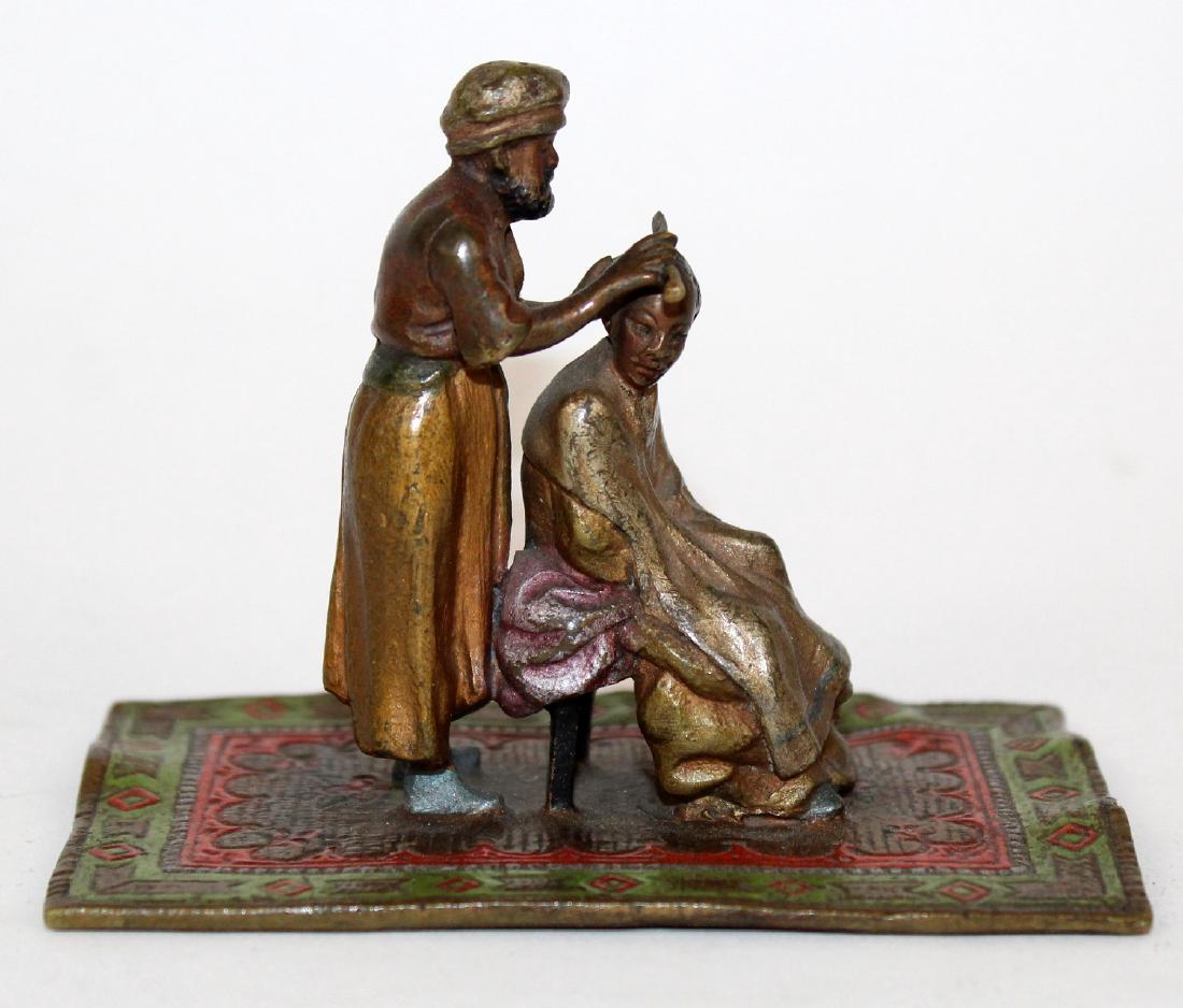 Cold painted figurine of 2 men (1 of 5)