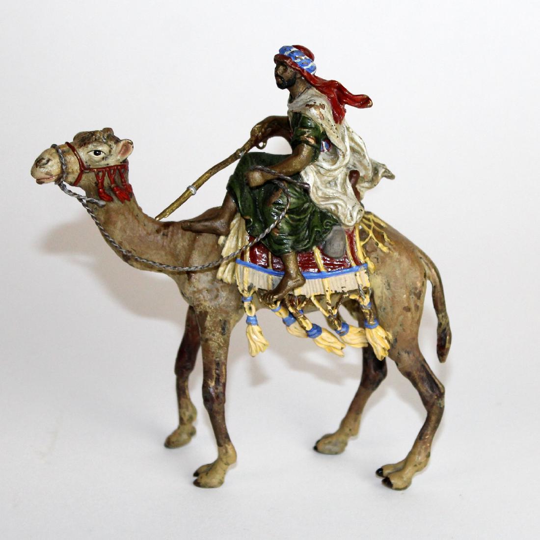 Cold painted bronze figurine of man on camel (1 of 4)