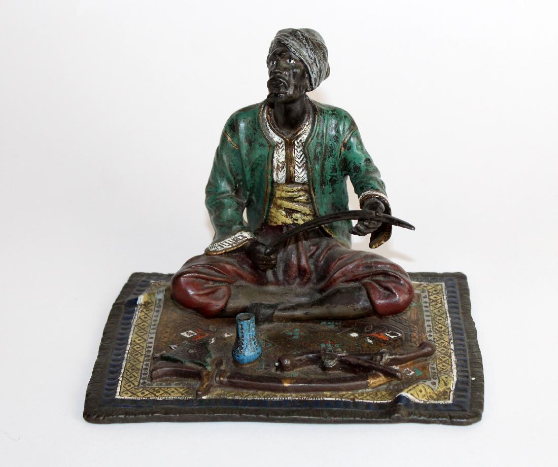Cold painted bronze figurine of merchant (1 of 5)