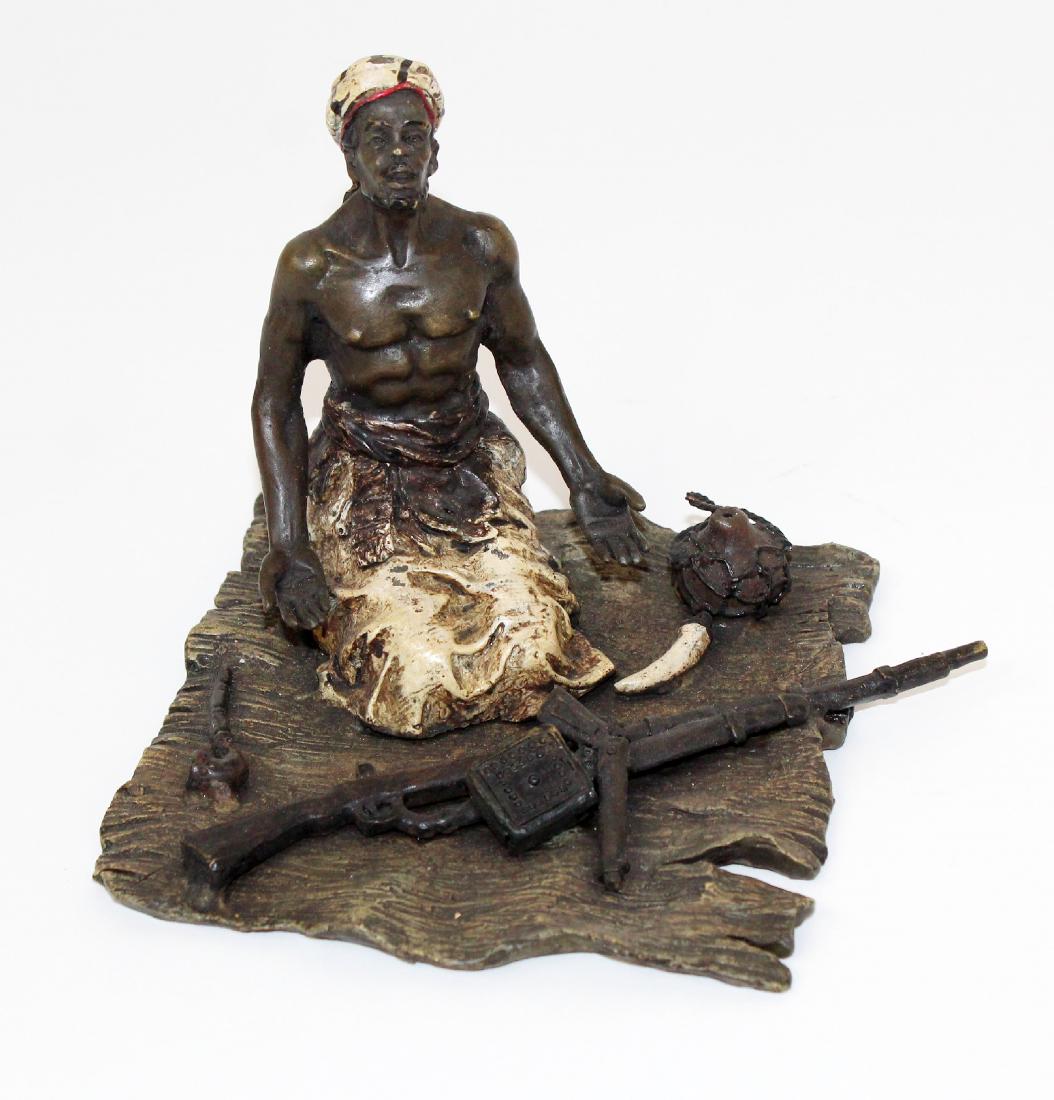 Cold painted bronze figurine of a man (1 of 4)