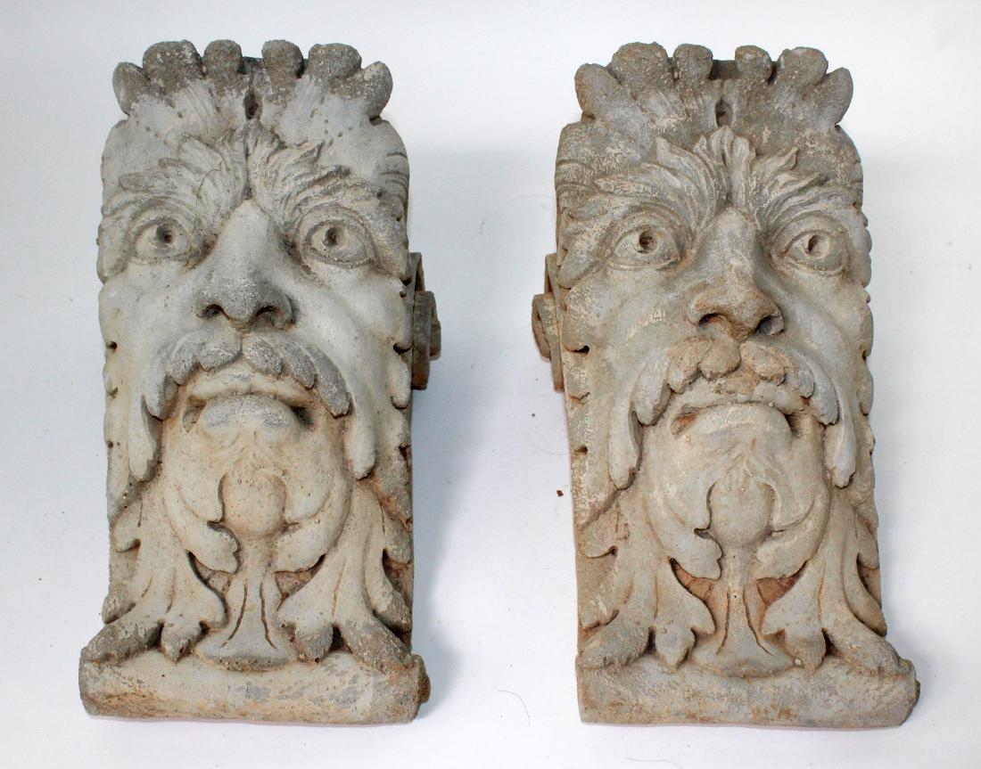 Pair of cast figural corbels: Pair of cast figural corbels. 12"h x 7"w x 8"d