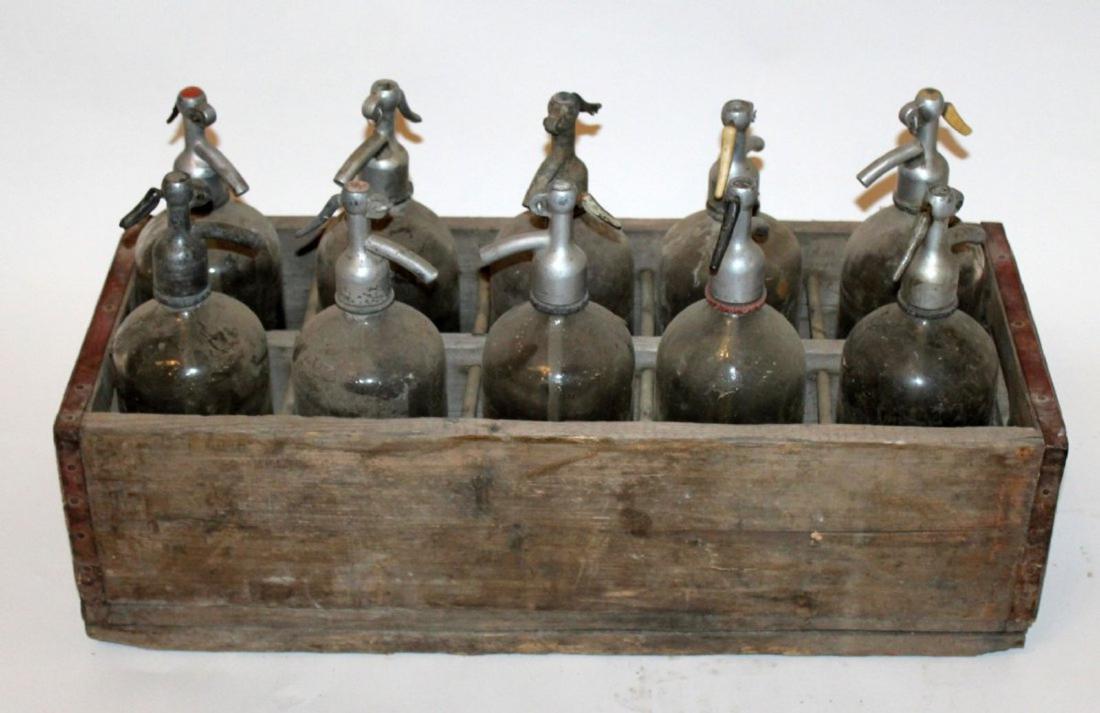 Antique wooden crate with seltzer bottles