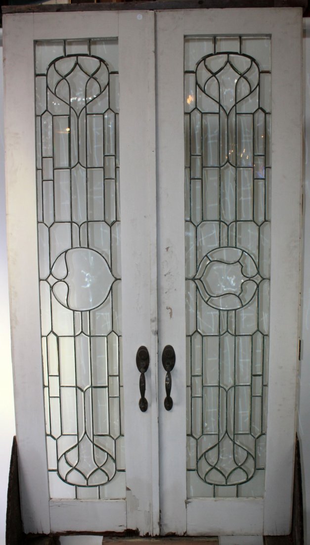 Pair of Antique American leaded glass entry doors: Pair of Antique American leaded glass entry doors in painted framed. 103 1/2"h x 57"w overall