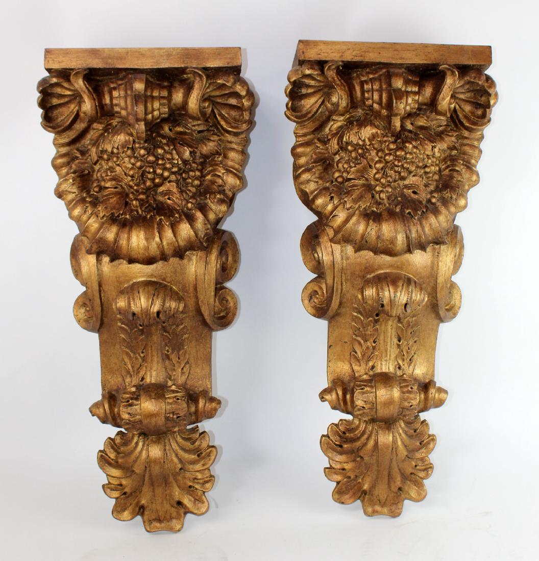 Pair of cast gilt corbels with grape detail: Pair of cast gilt corbels with grape detail. Late 20th century. 33"h x 13"w x 7"d