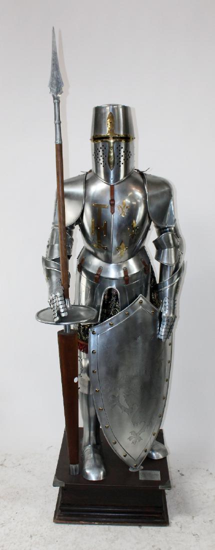 Marto Spanish suit of armor: Marto Spanish suit of armor with jousting helmet, shield and lance. 89"h x 28"w