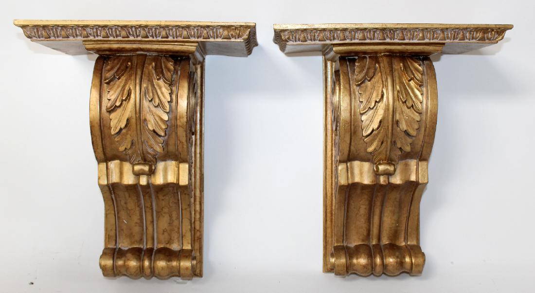 Pair of gold painted corbels: Pair of gold painted corbels with canthus leaves.21st century. 16"h x 30"w