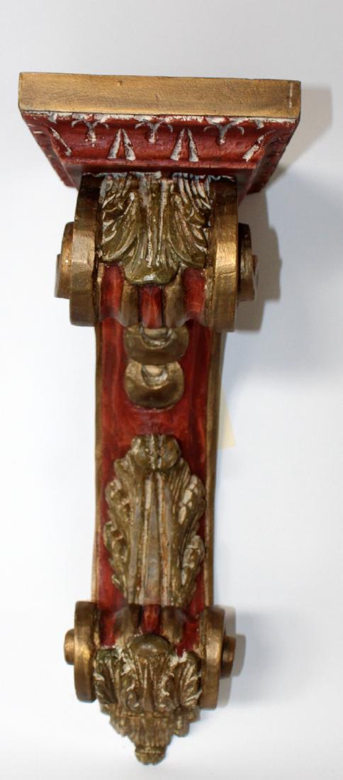 Painted red and gold plaster corbel (1 of 3)
