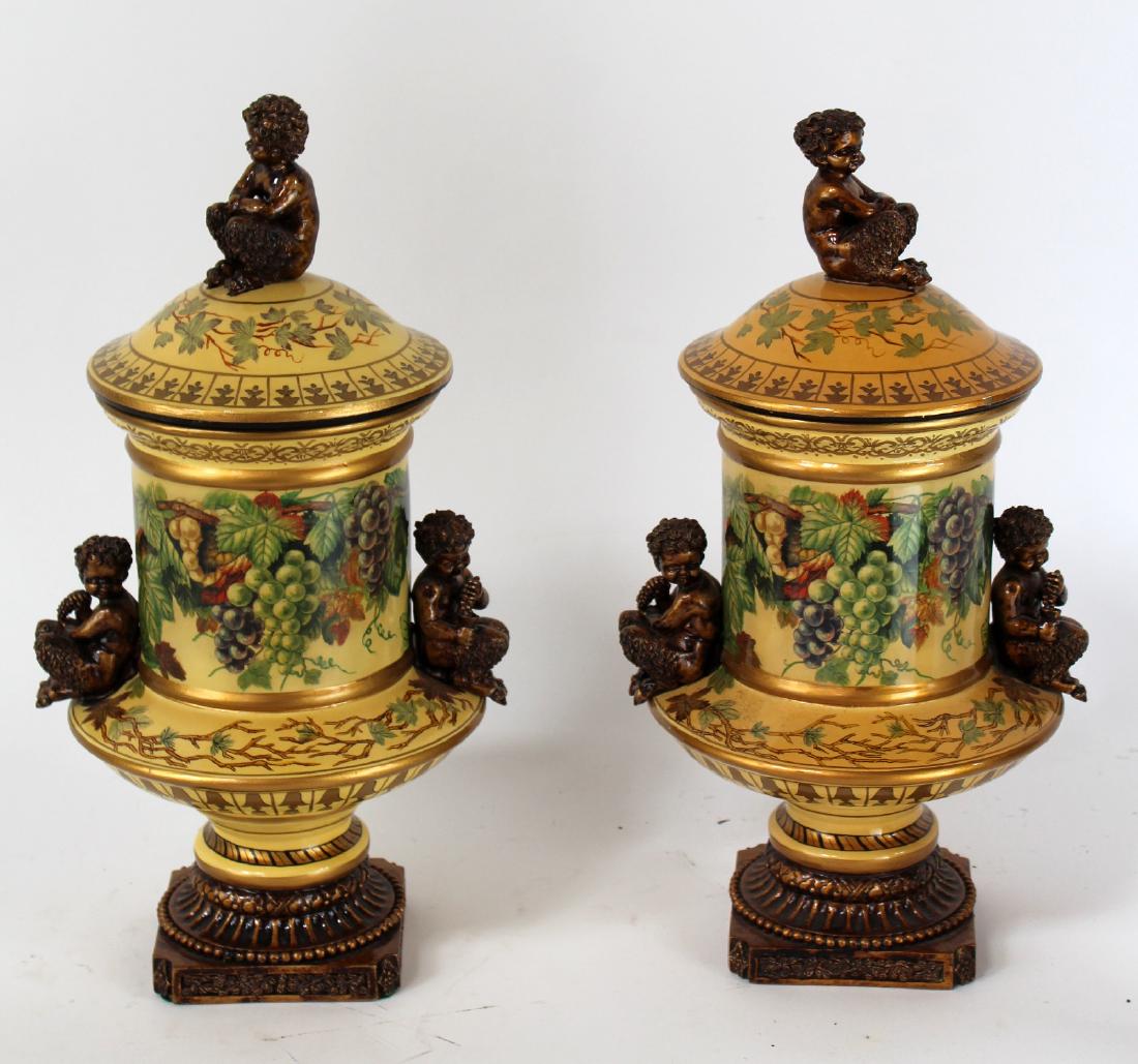 Pair of ceramic lidded urns with satyr (1 of 5)