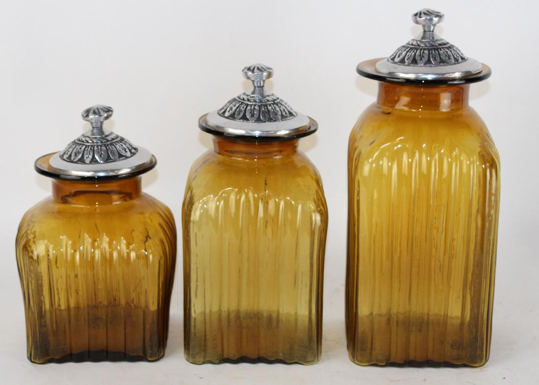 Set of 3 amber glass lidded canisters (1 of 3)