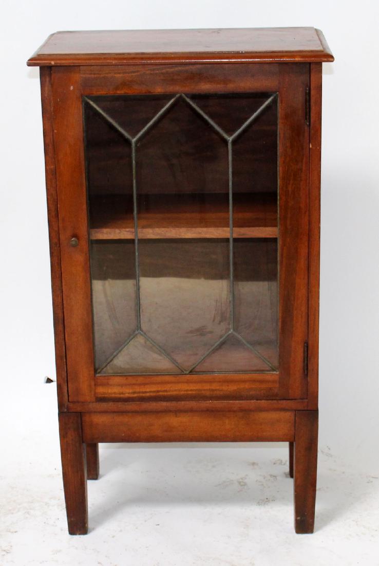 American Arts and Crafts leaded door cabinet: American Arts and Crafts cabinet with leaded glass door. 20th century. 35 1/2"h x 20"w x 11 1/2"d