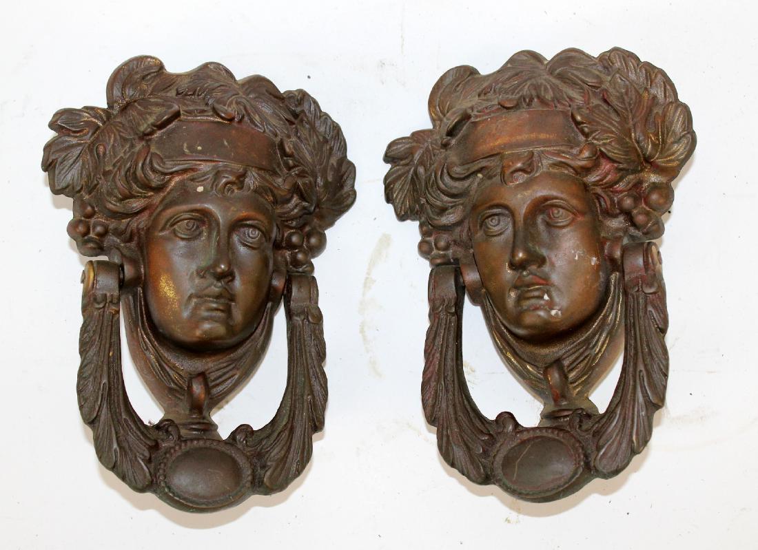Pair cast iron figural mask door knockers (1 of 3)