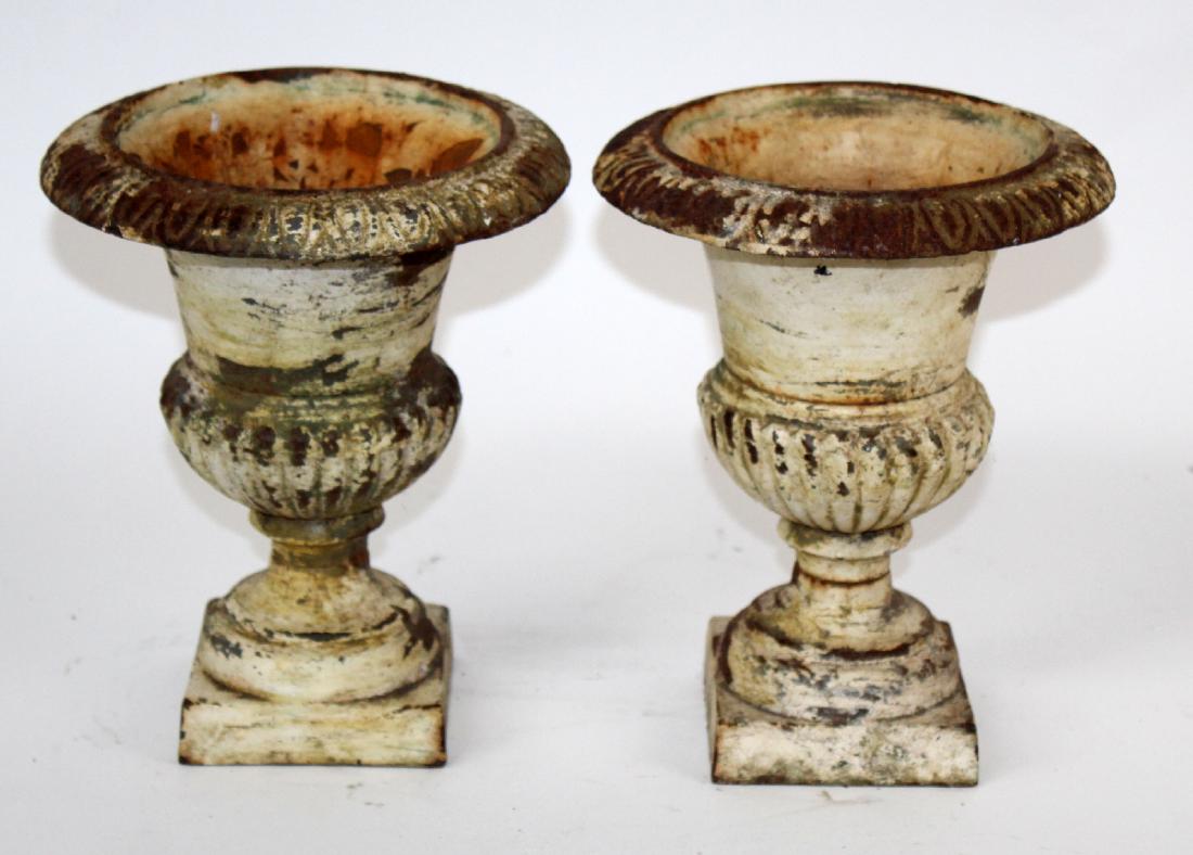 Pair of painted cast iron fluted urns (1 of 4)