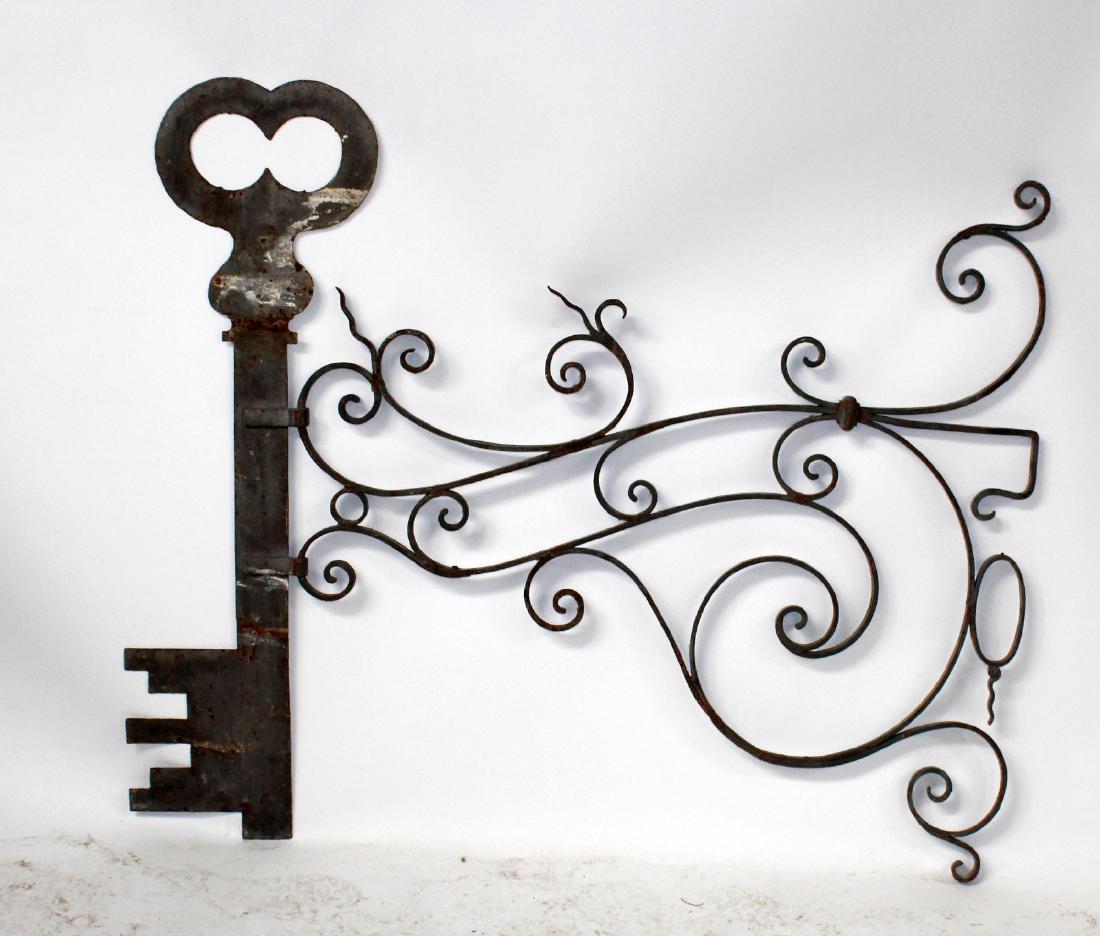 Antique trade advertising sign of a key (1 of 8)