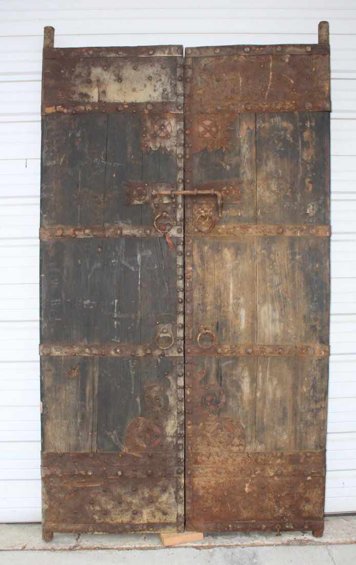 Pair of rustic wood doors with iron studs (1 of 7)