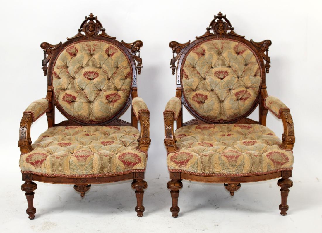 Pair of American Aesthetic movement arm chairs: Pair of American Aesthetic movement chairs in carved walnut featuring portrait plaques of Jenny Lind. Late 19th century. 42.5"H x 27.5"W x 25"D each