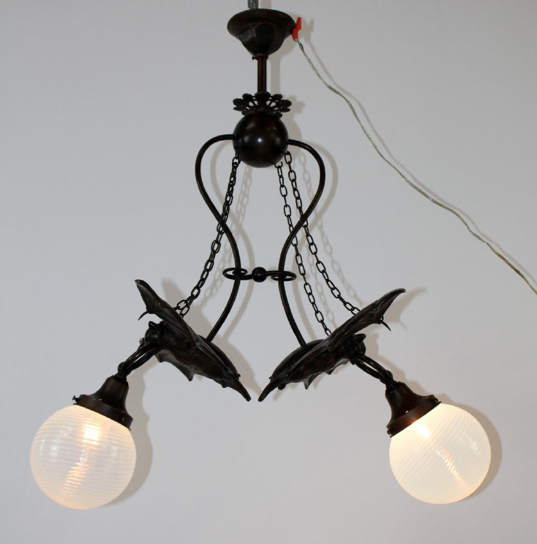 Bronze double Bat light with art glass shades: Bronze double Bat light with art glass shades. 32"h x 27"w