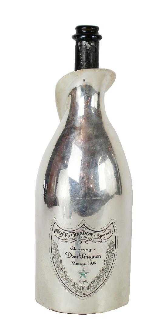 1995 Dom Perignon Jerobaum bottle: Rare limited edition 1995 Dom Perignon Jerobaum bottle made for the Byblos Hotel in Saint Tropez. 1 of 10 made. This one is marked no. 8. Bottle feature a White Gold plated "robe" with emeralds. 17 1/