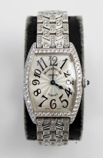 Franck Muller 18kt gold and diamond ladies watch: Franck Muller Cintree Curvex 18kt white gold and diamond ladies watch with original box. 35mm x 25mm. Back of watch marked Franck Muller Geneve No. 4792 1752 QZ D. The band has purity mark 750 indicat