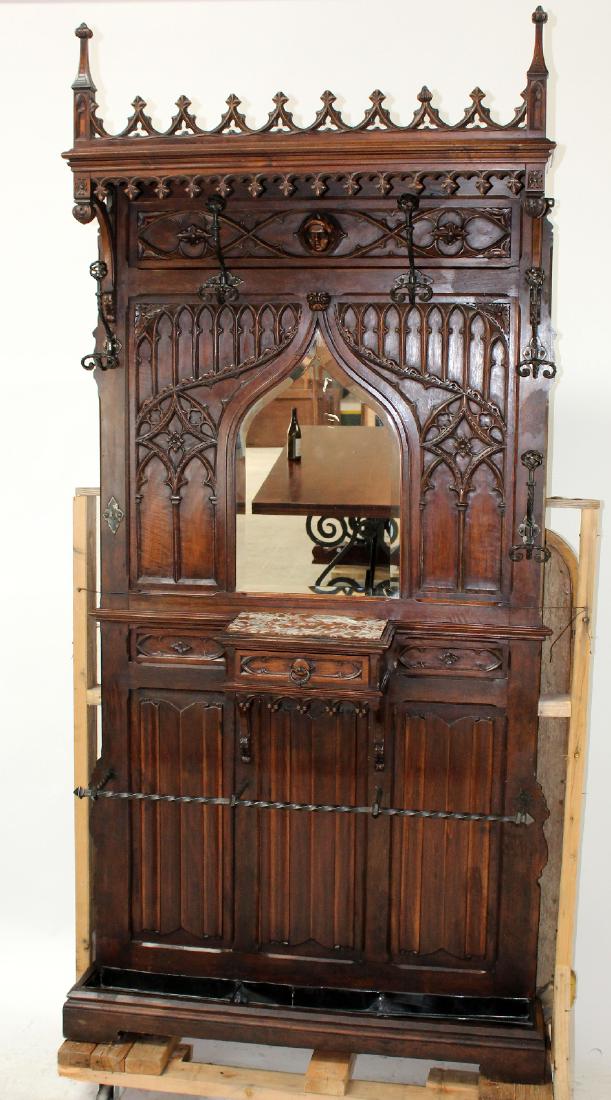 French Gothic Revival carved walnut halltree: French Gothic Revival carved walnut halltree. Late 19th century. 96"h x 48"w