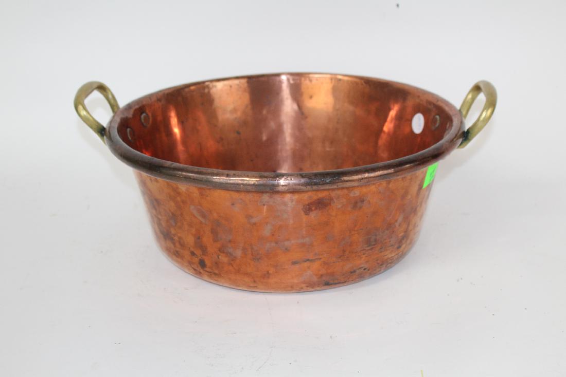 French copper double handled pot: French copper double handled pot. 8" deep x 19 1/2" diameter with handles.