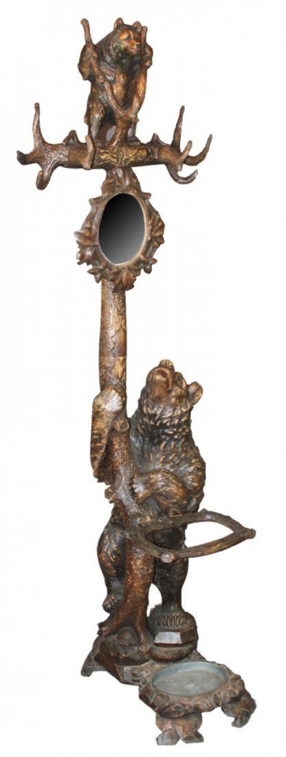 Black Forest bear hall tree: Exceptional carved Black Forest bear hall tree with umbrella stand and mirror. The lower bear looking upward into the "tree" at a cub playing in the branches. Finely detailed expert carving and glass 