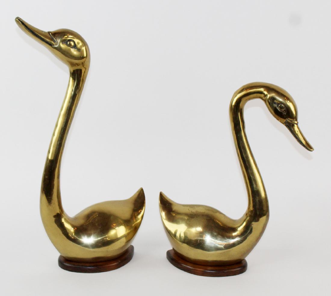 Pair of brass swans on wooden bases: Pair of brass swans on wooden bases. 23 1/2"h-18"h x 14 1/2"w