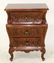 Carved mahogany bombe small chest of drawers