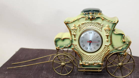 Cinderella coach clock on brass stand: Cinderella coach clock on brass stand. 9 1/2"h x 19"w x 5"d