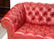 Studded red leather chesterfield sofa - 5