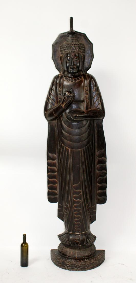 Lifesize carved wooden Quan Yin sculpture: Lifesize carved wooden Quan Yin sculpture. Ebony finish. Late 20th century. 87"h x 21"w x 10"d