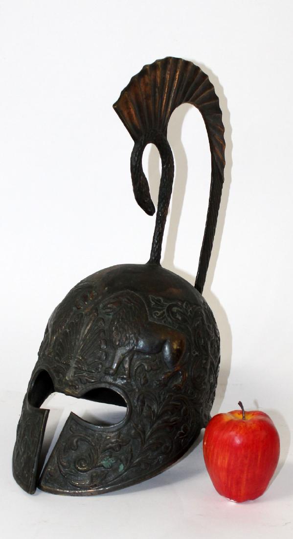 Bronze helmet with lions: Bronze helmet with lions and peacock. 17"h x 8 1/2"w x 13"d