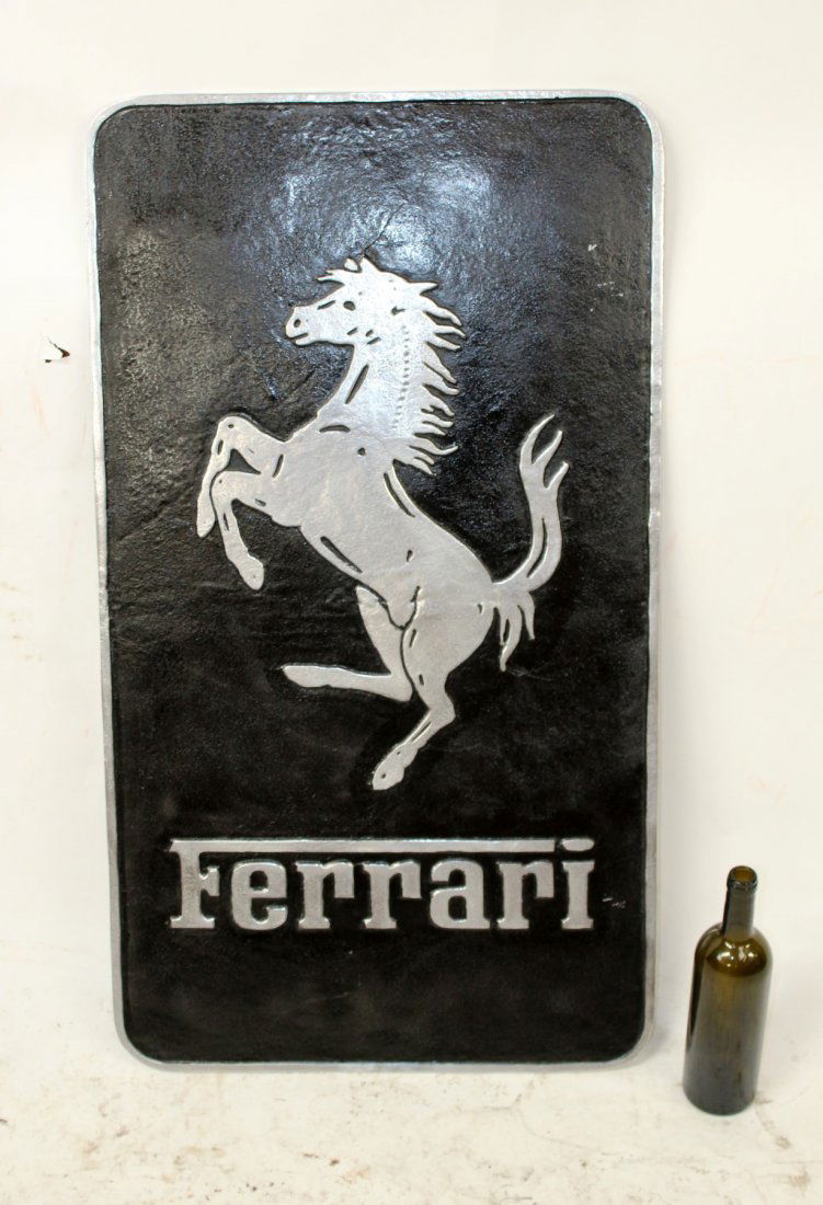 Metal Ferrari sign with stallion on black background (1 of 6)