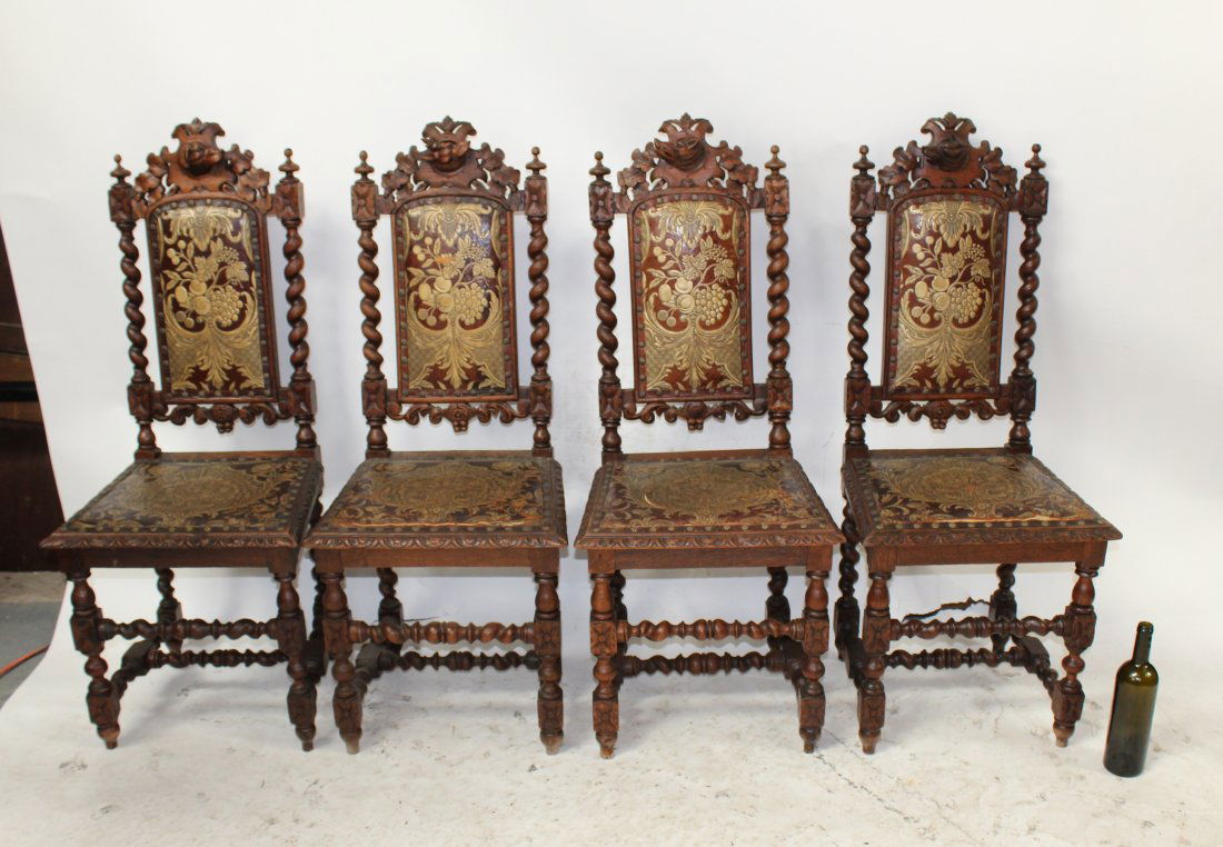 4 French chairs with tooled leather and dog head mounts: Set of 4 French chairs with tooled leather and dog head mounts. 44 3/4"h x 18 1/4"w x 17"d Seat height is 19"