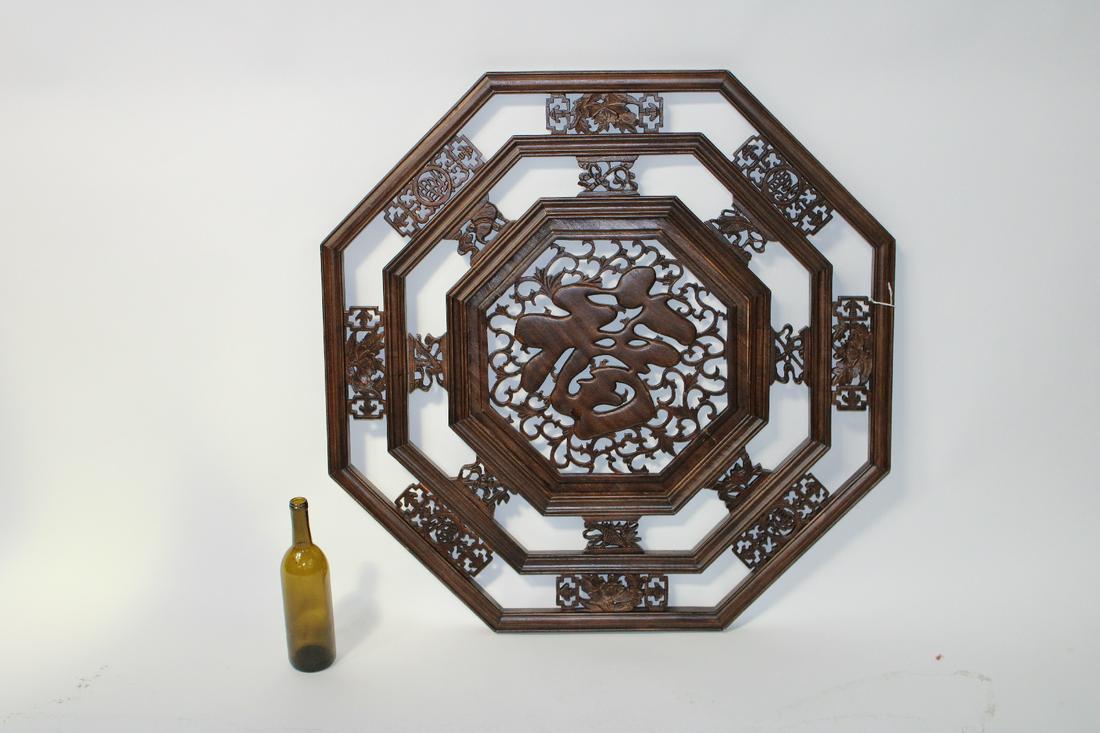 Oriental carved octagonal wall plaque (1 of 4)