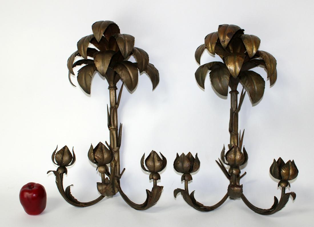 Pair of palm motif candle wall sconces: Pair of palm motif candle wall sconces in painted metal. 20th century. 24"h x 15"w