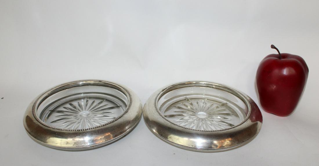 Pair of cut glass & silver wine bottle coaster: Pair of cut glass wine bottle coasters with silver rims. 7 7/8"dia