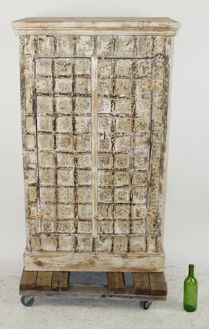Distressed studded Tibetan style cabinet (1 of 8)