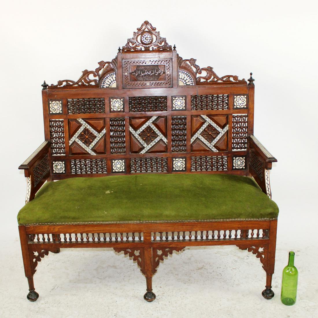 Moroccan fretwork settee with inlays: Moroccan fretwork settee with inlays. Arabic writing carved in back. 52 1/2"h x 48 1/2"w x 24"d