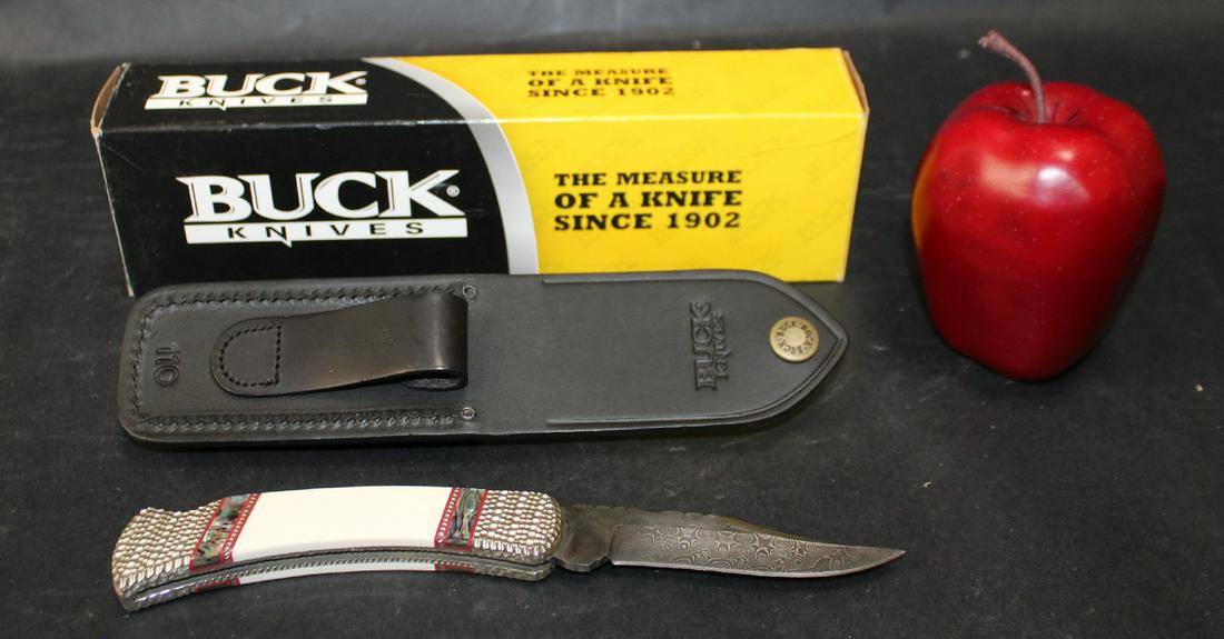 Buck knife folding hunter painted pony proto: Buck knife folding hunter marked 'painted pony proto' pocket knife with Damascus blade. Engraved bolster. Mother of pearl handle. With leather sheath. And box. 3 1/2" blade. 5" long closed.